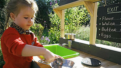 Cooking with whatever nature has to offer in an outdoor play kitchen